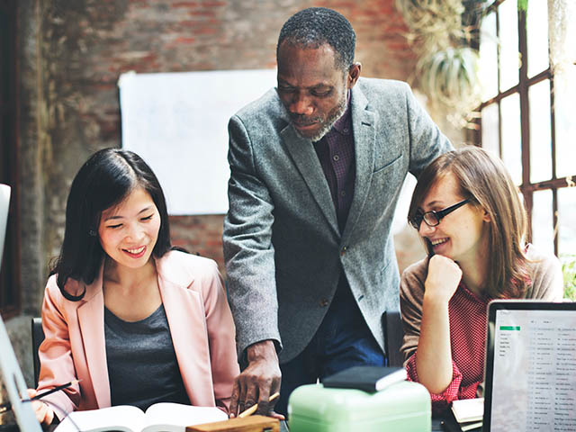 Three people working together